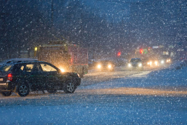 istock Heavy snowfall in city dvidenie machines. 640144068