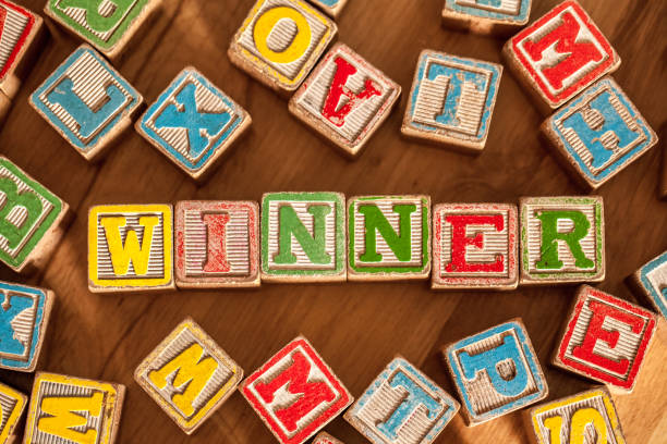 istock Wooden Toy Blocks Spell Winner 640144352