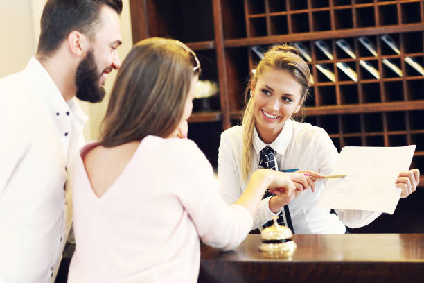 istock Couple at reception desk in hotel 640144394
