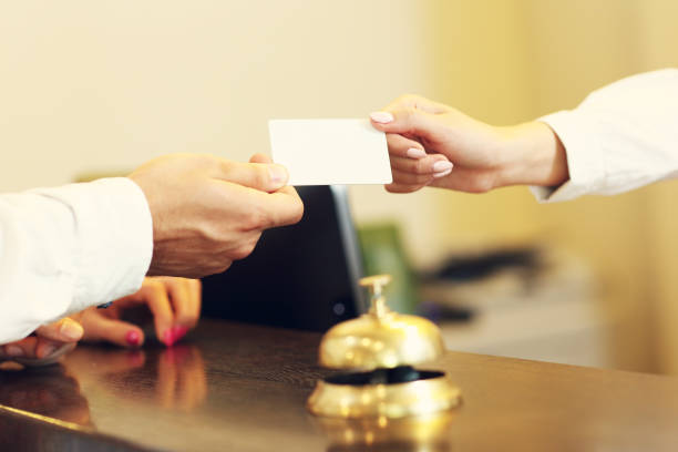 istock Guests getting key card in hotel 640144688
