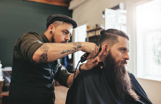 istock Man getting trendy haircut in barbershop 640146844