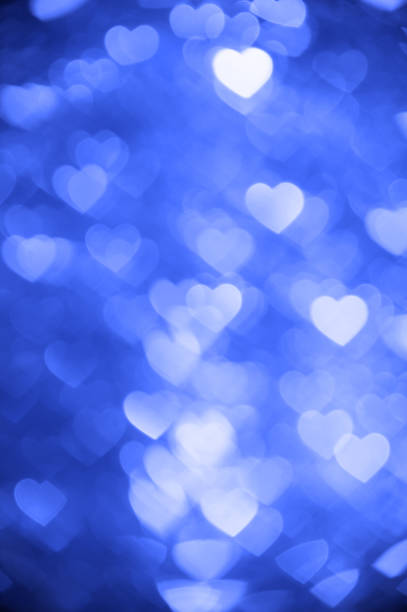 istock dark blue heart bokeh background photo, abstract holiday backdrop 640147580