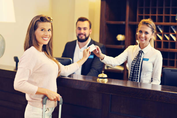 istock Woman at reception desk in hotel 640148926