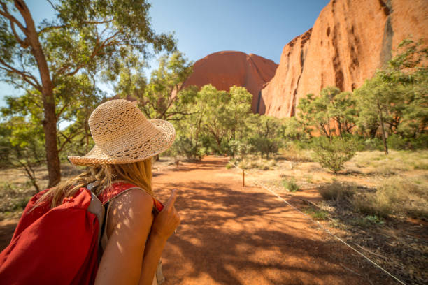 Young woman in Australia hiking Young woman in Australia hiking looks at the spectacular landscape. alice springs photos stock pictures, royalty-free photos & images