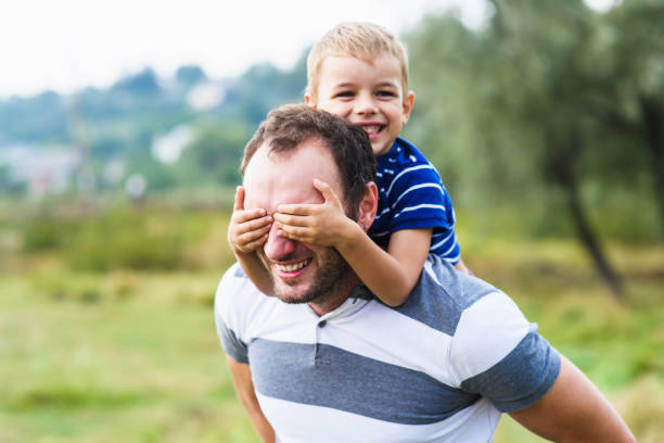 istock Boy closes hands eyes father 640149960
