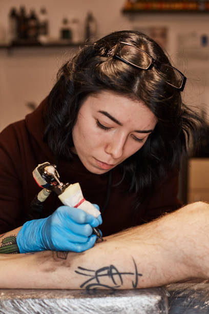 istock Tattoo artist is making 640149994