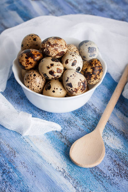 istock Quail eggs in bowl wooden spoon and gauze 640150394