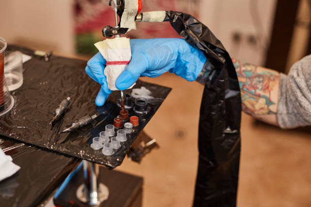 istock Master tattoo artist prepares tools for tattooing 640151312