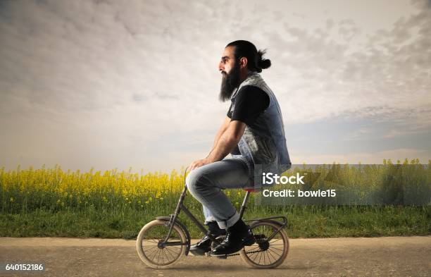 Small Bicycle For A Big Boy Stock Photo - Download Image Now - Bicycle, Cycling, Humor