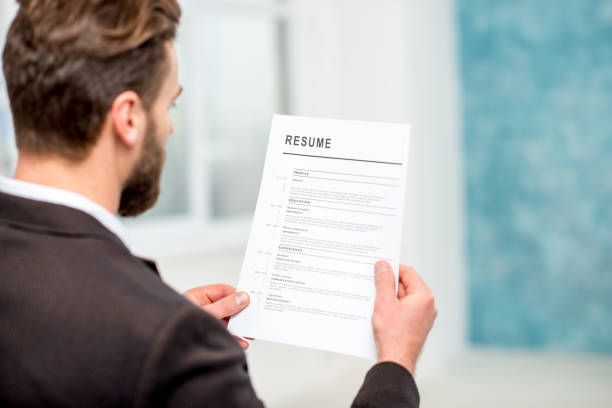 istock Recruiter with resume paper 640152380