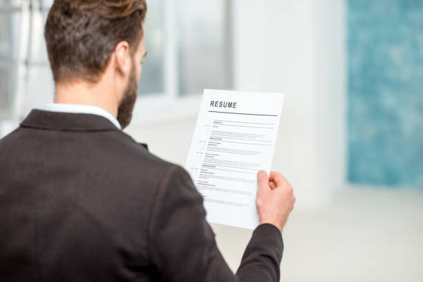 istock Recruiter with resume paper 640152486