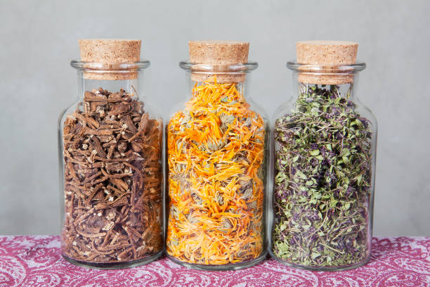 istock Dried teas herbs inside glass bottles. 640152732