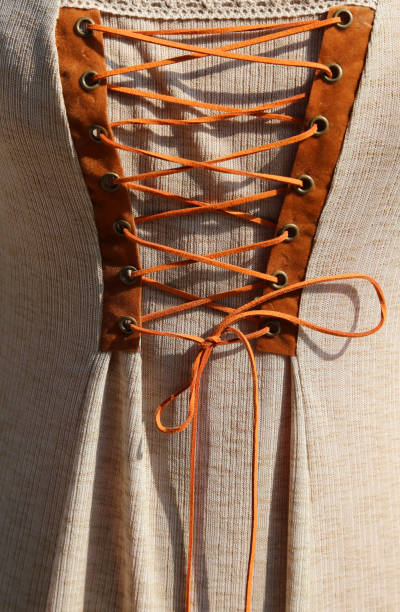 istock intertwining with the string of an ancient medieval dress 640152980