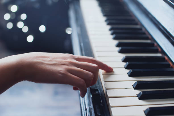 istock girl playing on an old piano vintage 640156476