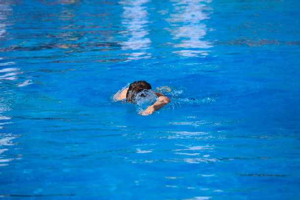 istock Young man swimming in a pool    Male swimmer 640157830