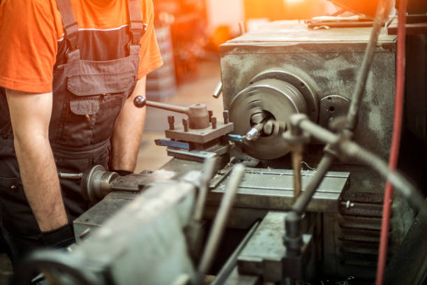 istock Close up of unrecognizable machinist working on drill bit. 640162622