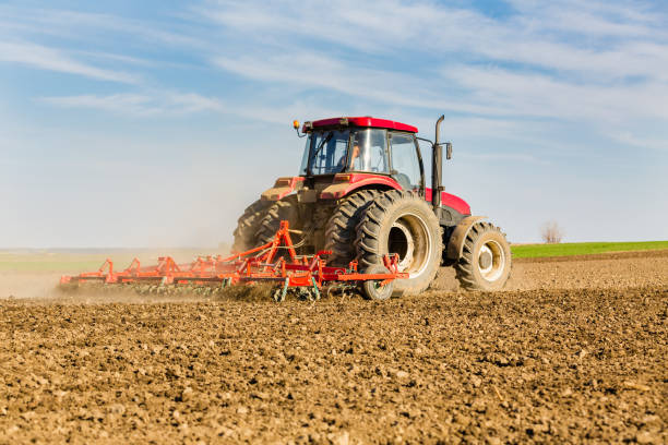 istock Farmer in tractor preparing land with seedbed cultivator. 640162648