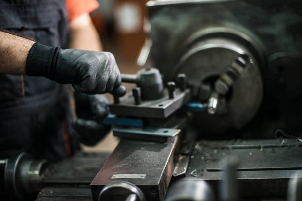 istock Close up of unrecognizable machinist working on drill bit. 640162756