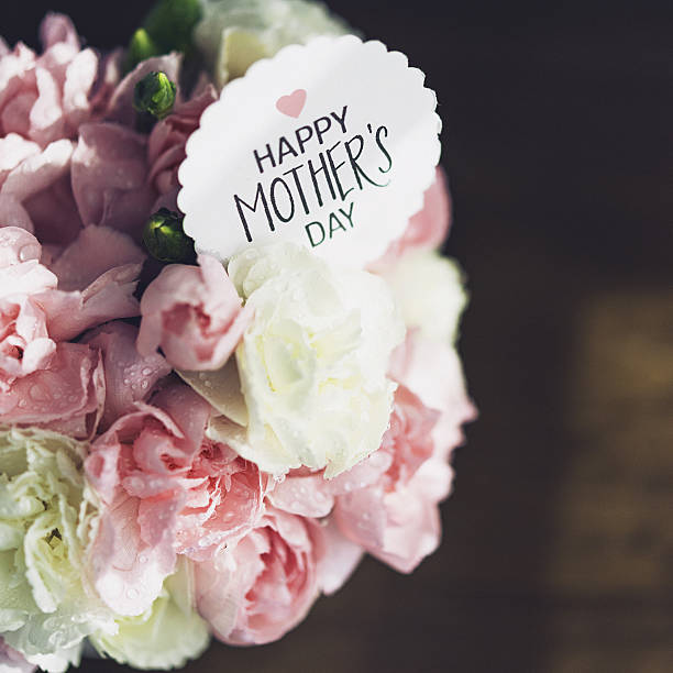 istock Mother's Day still life. Pastel colored flowers with message 640162904