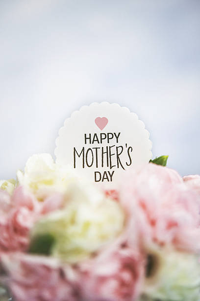istock Mother's Day still life. Pastel colored flowers with message 640163100