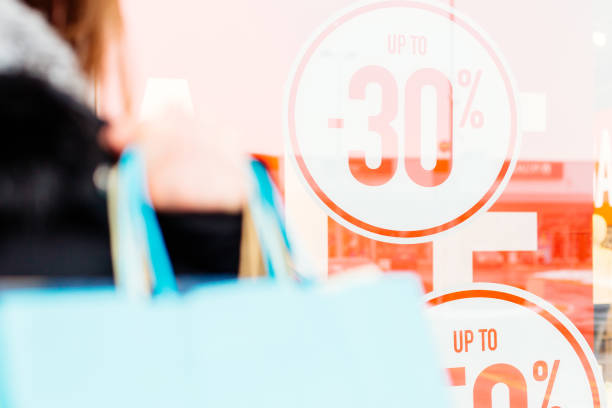 istock Woman holding shopping bags 640163616