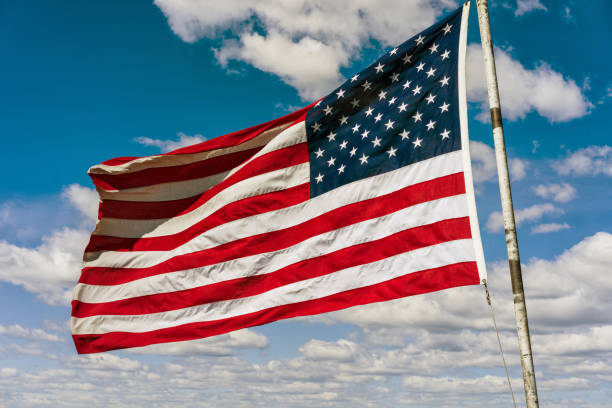 istock American national flag in front of Boston sky 640165962