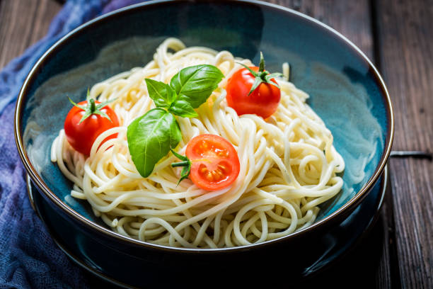 istock Tasty spaghetti with tomatoes, basil and parmesan 640167284