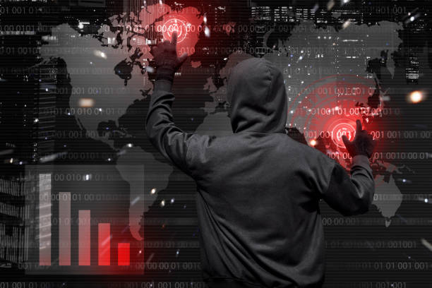 istock Back view of hooded hacker at work with virtual graphic 640170458