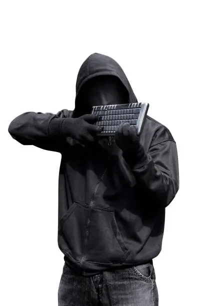 Man wearing vendetta mask holding keyboard want to shoot isolated against white background