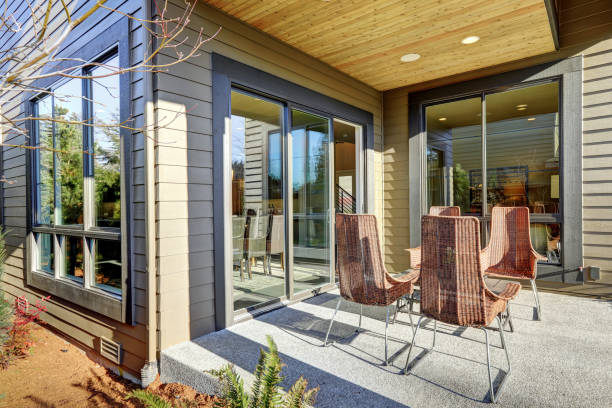 istock Backyard covered patio design with high back wicker chairs 640171574