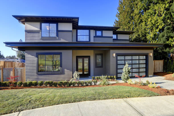 istock New construction home with low slope roof and brown siding. 640172572