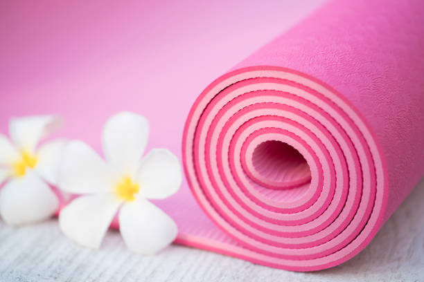 istock pink yoga mat and a flowers 640172916