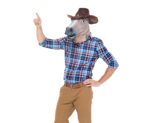 istock Cowboy in horse costume and pointing 640176176