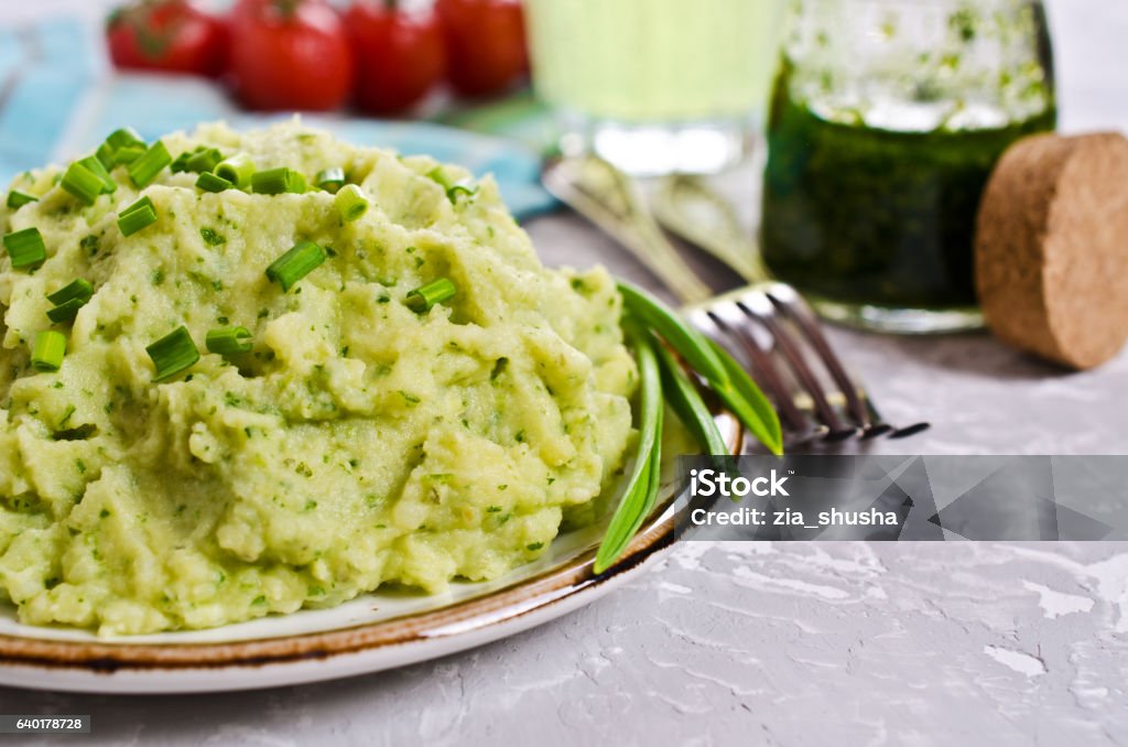 Green mashed potatoes Green mashed potatoes in a plate batch. Selective focus. Mash - Food State Stock Photo