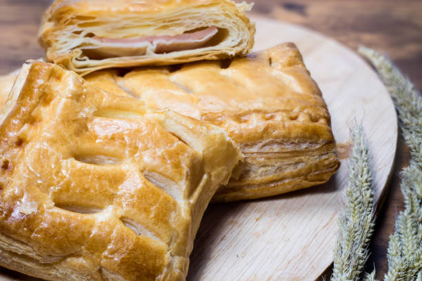 istock Ham and cheese filled pie on wood table 640179148