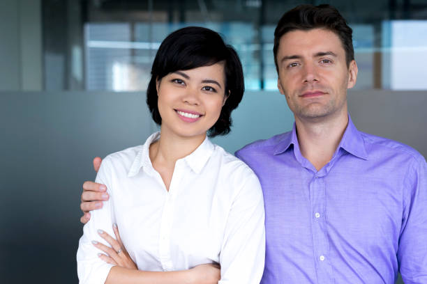 istock Confident businessman embracing smiling colleague 640180370