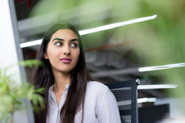 istock Confident young businesswoman sitting at computer 640180434