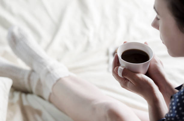 istock Woman drinking coffee in the bed 640181106