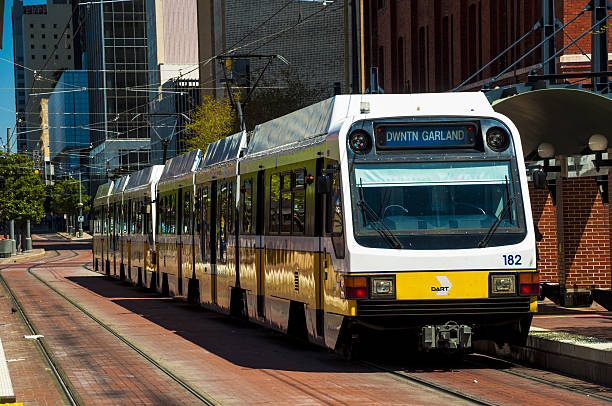Dallas, United States - April 9th, 2010: A DART Lightrail train at a station in Downtown Dallas.
