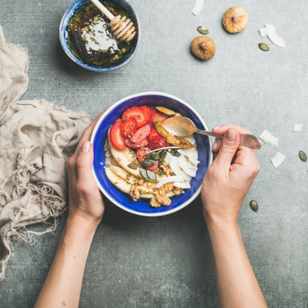 istock Eating healthy breakfast bowl over grey concrete background 640185482