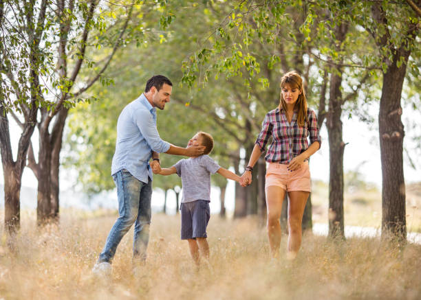 istock Happy family taking a walk in nature together. 640185538