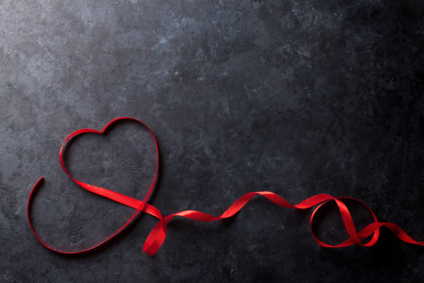 istock Valentines day. Heart shaped red ribbon 640185580