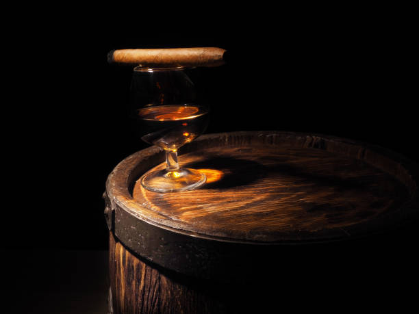 istock Cognac and Cigar on old oak barrel 640185934