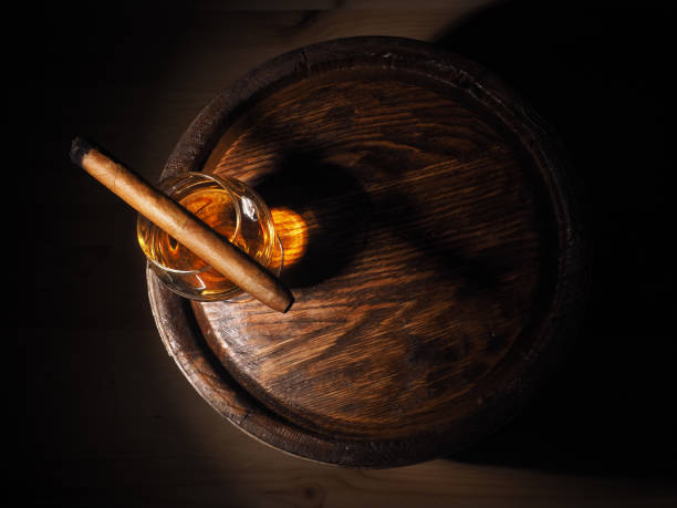 istock Cognac and Cigar on old oak barrel 640185964