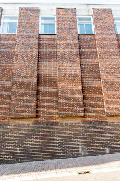 istock Red brick wall background on a street in England 640185992