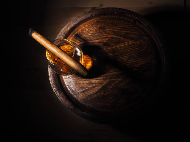 Cognac and Cigar on old oak barrel