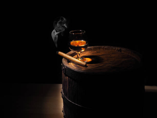 Cognac and Cigar on old oak barrel