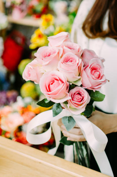 istock Sad drying rose with petals on the ground 640186058