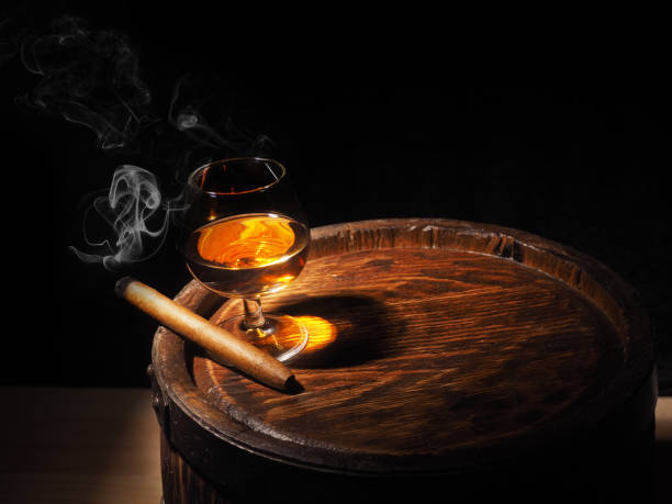 istock Cognac and Cigar on old oak barrel 640186104