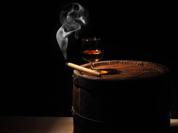 istock Cognac and Cigar on old oak barrel 640186124